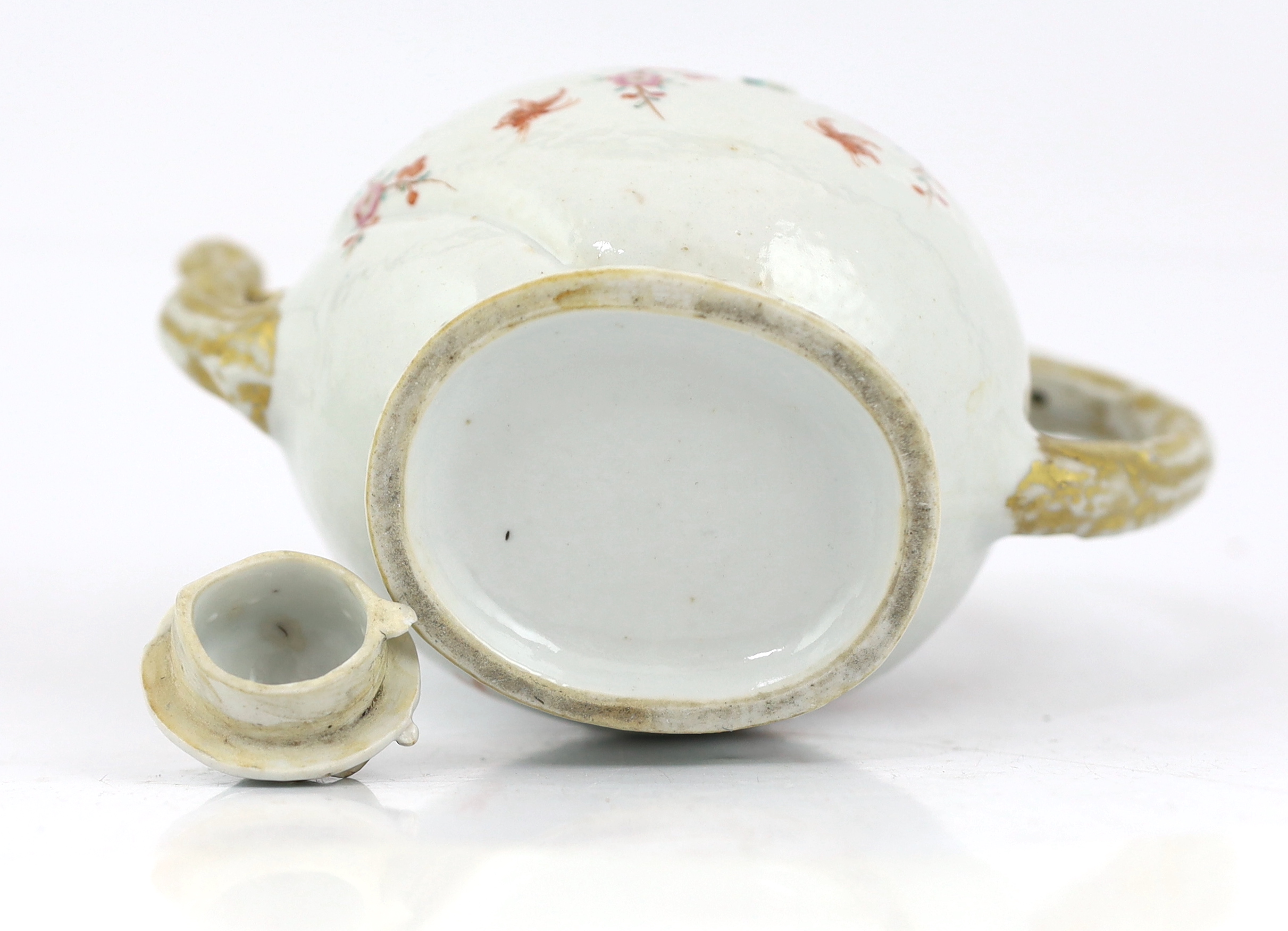 A Chinese enamelled porcelain peach-shaped teapot, Qianlong period (1736-95), wear to gilding